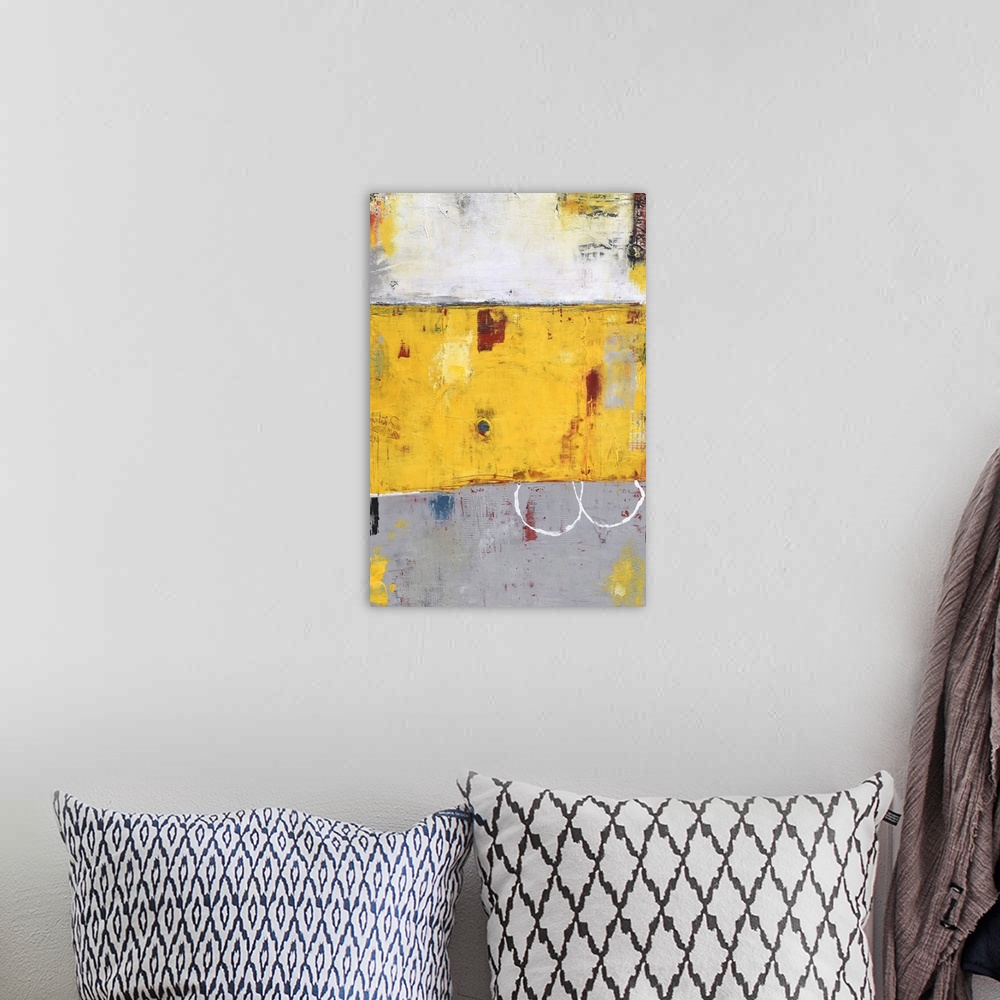 A bohemian room featuring Contemporary abstract color field style painting using yellow and gray.