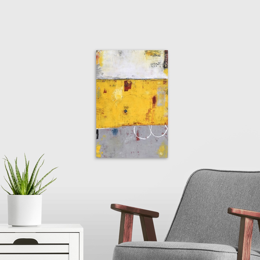 A modern room featuring Contemporary abstract color field style painting using yellow and gray.