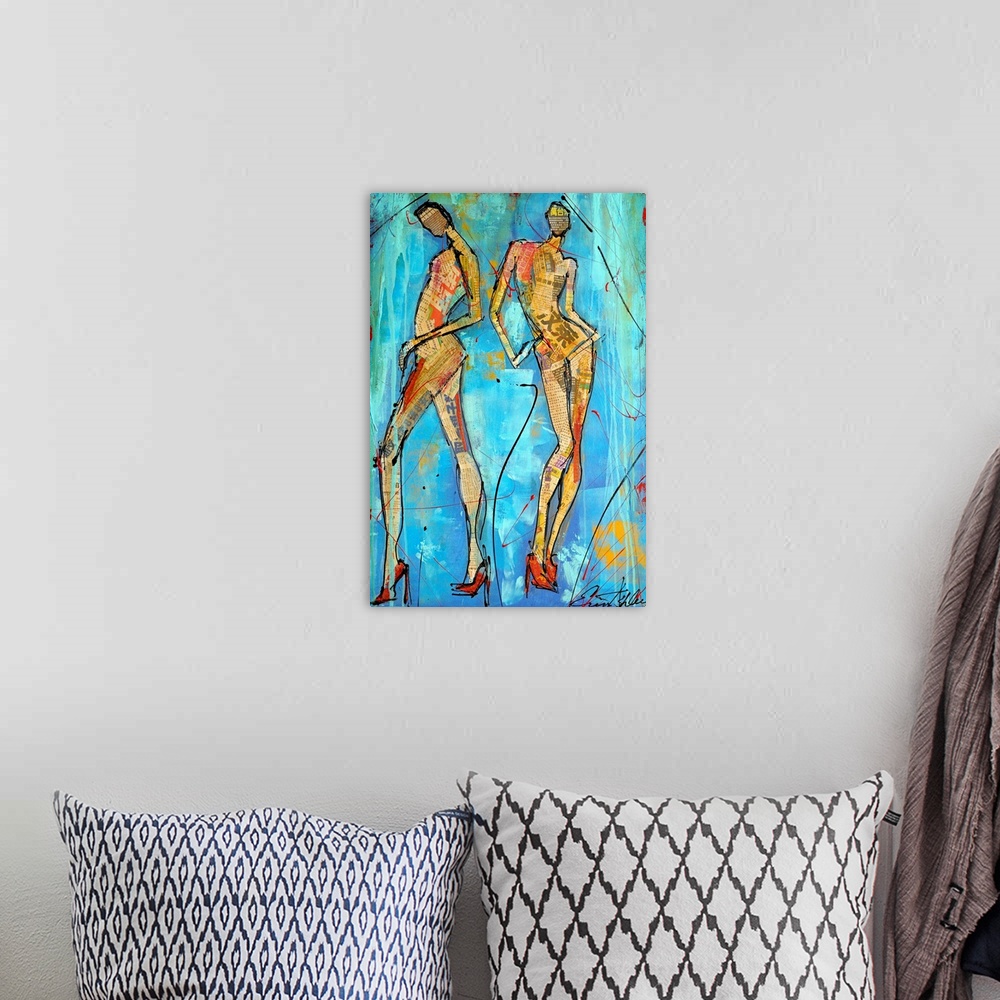 A bohemian room featuring This vertical mixed media painting is an abstract two elongated female figures filled with newspr...