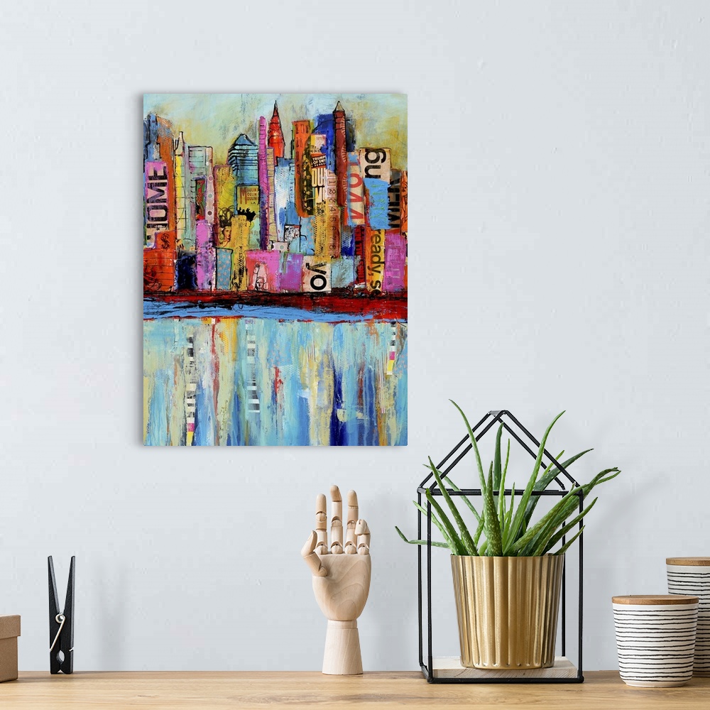 A bohemian room featuring Contemporary art piece that uses different colors and patches to create a city skyline which soft...