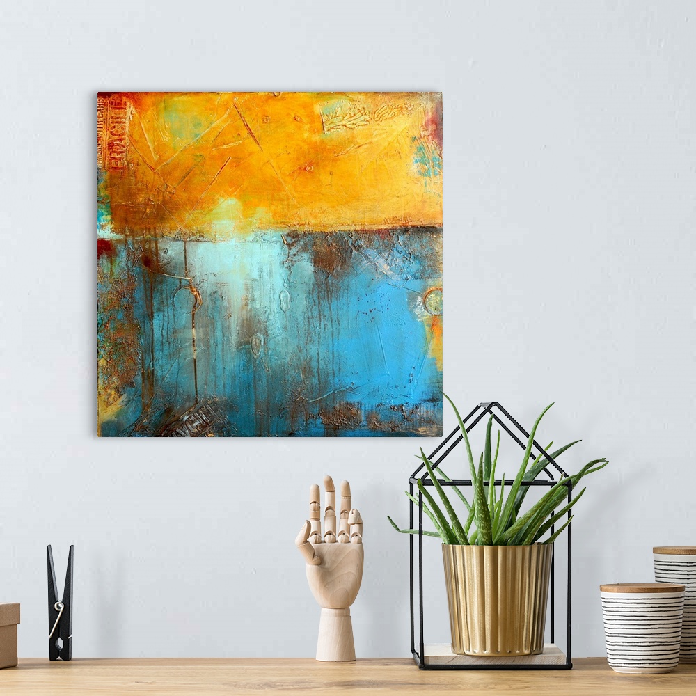 A bohemian room featuring A contemporary abstract painting using a golden yellow and light blue meeting together like two w...