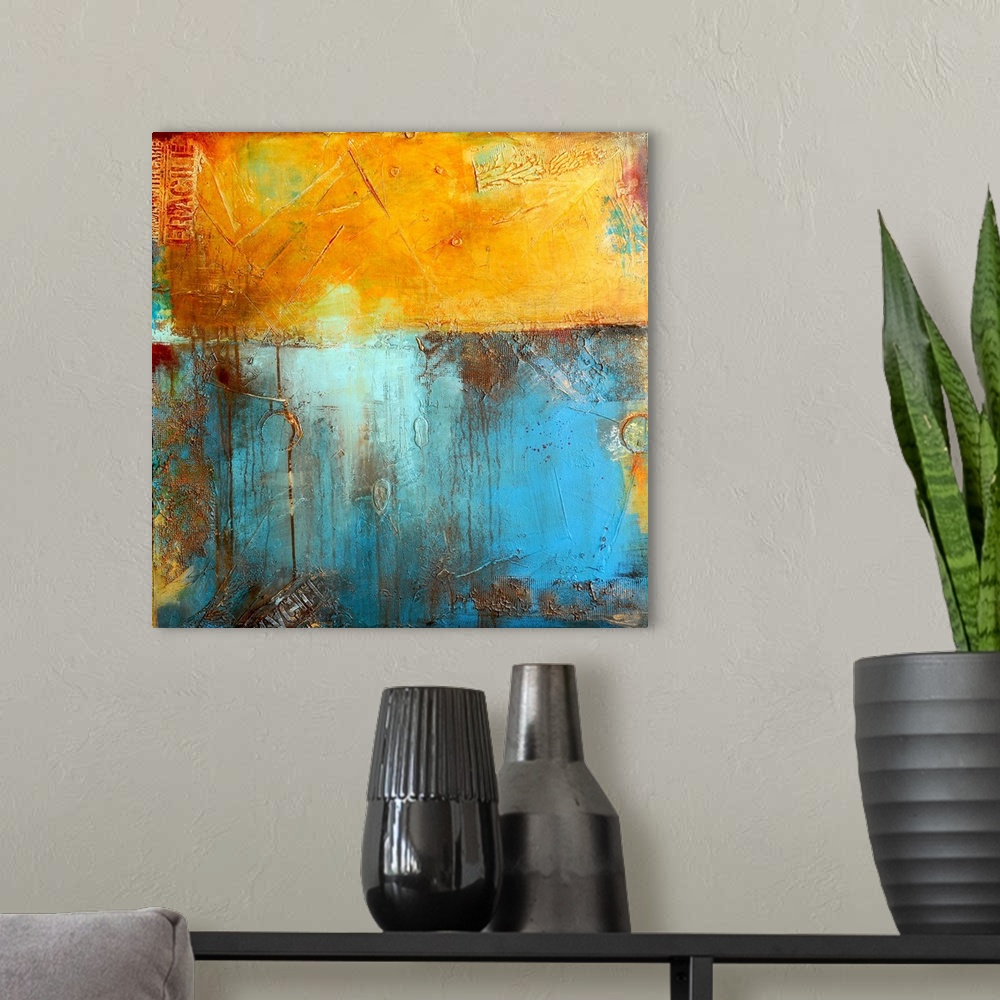 A modern room featuring A contemporary abstract painting using a golden yellow and light blue meeting together like two w...