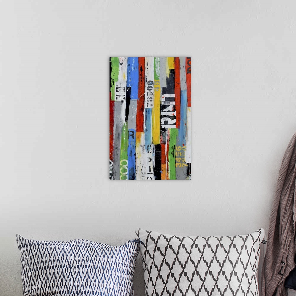 A bohemian room featuring A contemporary abstract painting using multiple colors and partially stenciled letters in vertica...