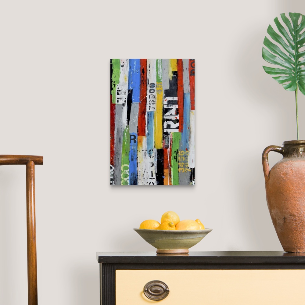 A traditional room featuring A contemporary abstract painting using multiple colors and partially stenciled letters in vertica...