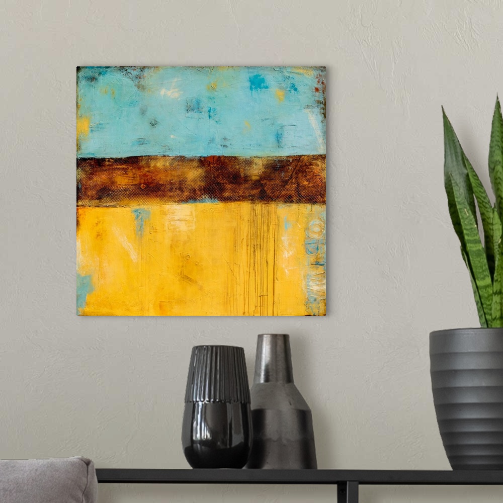 A modern room featuring Square abstract painting created with shades of blue and yellow with a thick, textured, brown, ho...