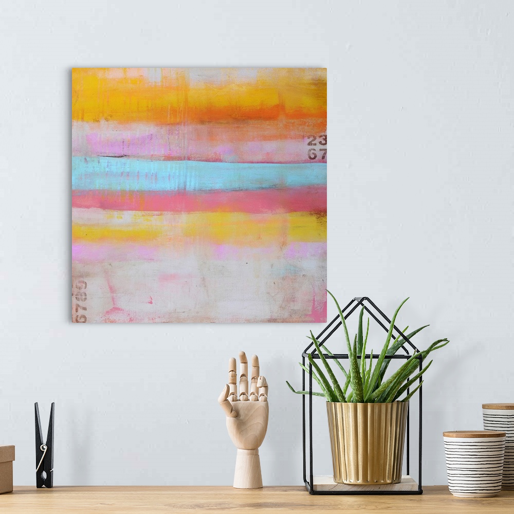 A bohemian room featuring An abstract painting on a square shaped canvas of horizontal stripes of pastel colors, sanded pai...