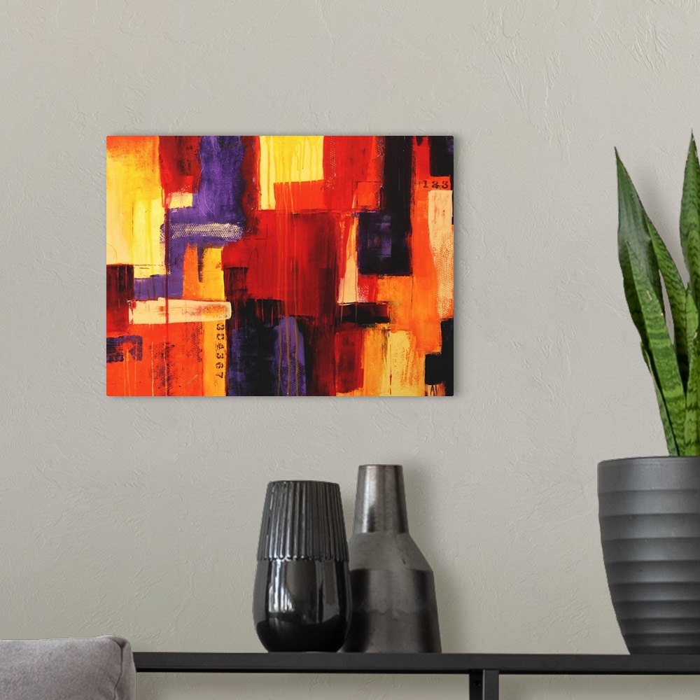 A modern room featuring Large abstract painting of various colored large brushstrokes put together on canvas.