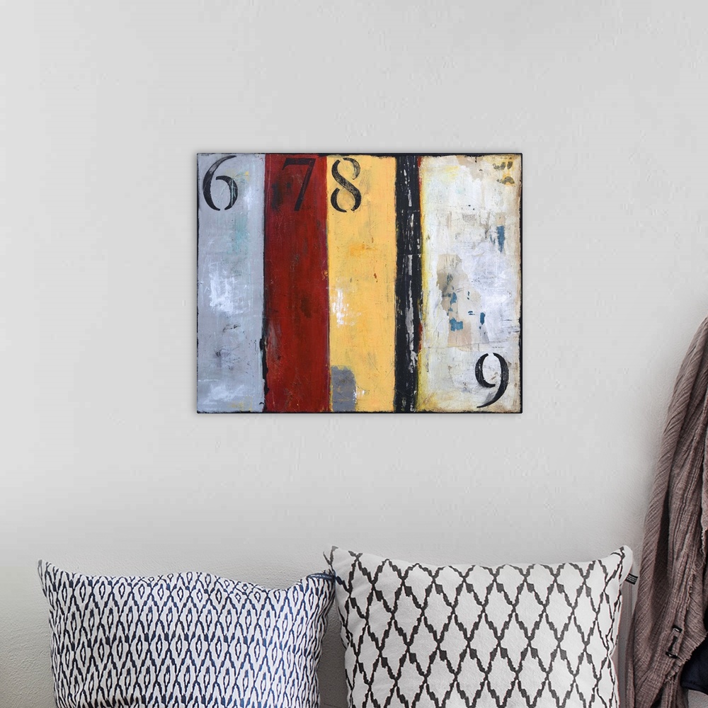 A bohemian room featuring A contemporary abstract painting with grey, red, yellow and black vertical panels and the number ...