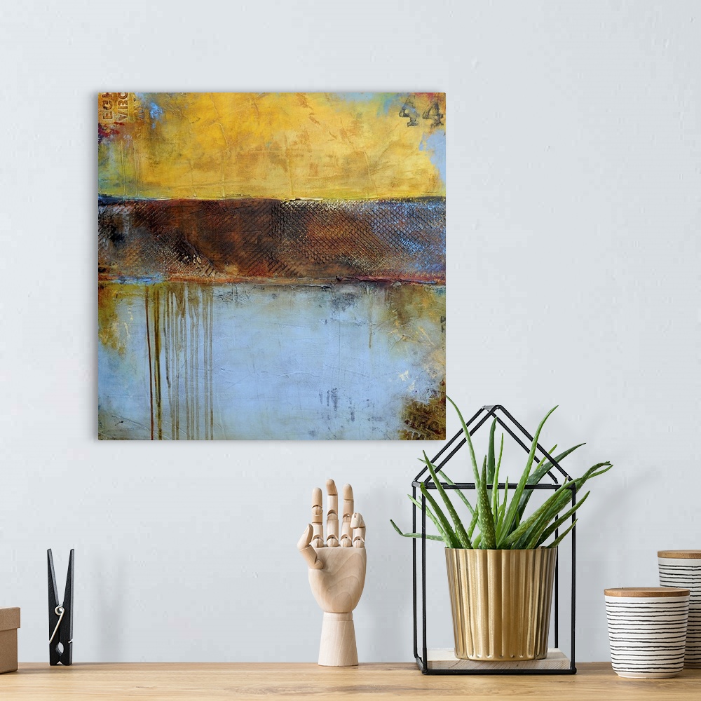 A bohemian room featuring Contemporary abstract painting of a color-field of weathered yellow brown and pale blue tones.