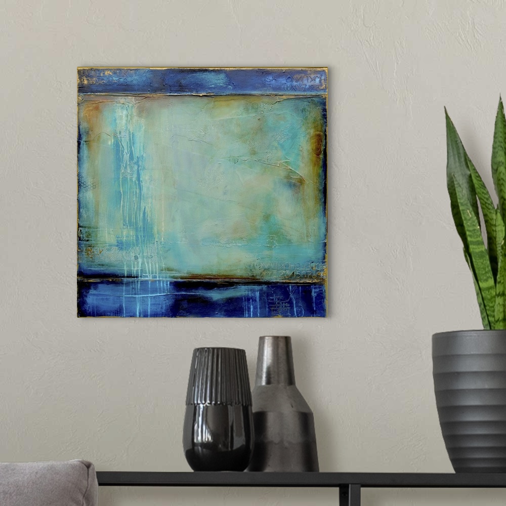 A modern room featuring Abstract contemporary art print in color blocks of navy blue and textured turquoise.