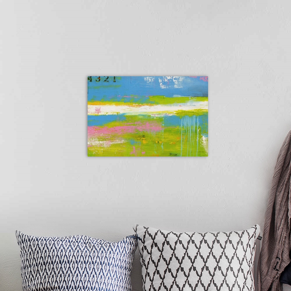 A bohemian room featuring This is a horizontal abstract painting of lengthwise streaks of neon and pastel colors.