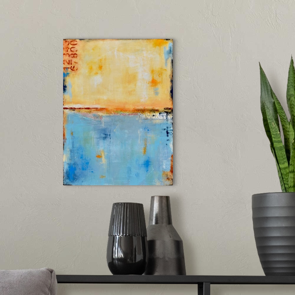 A modern room featuring Contemporary abstract painting using earthy tan colors with blue.