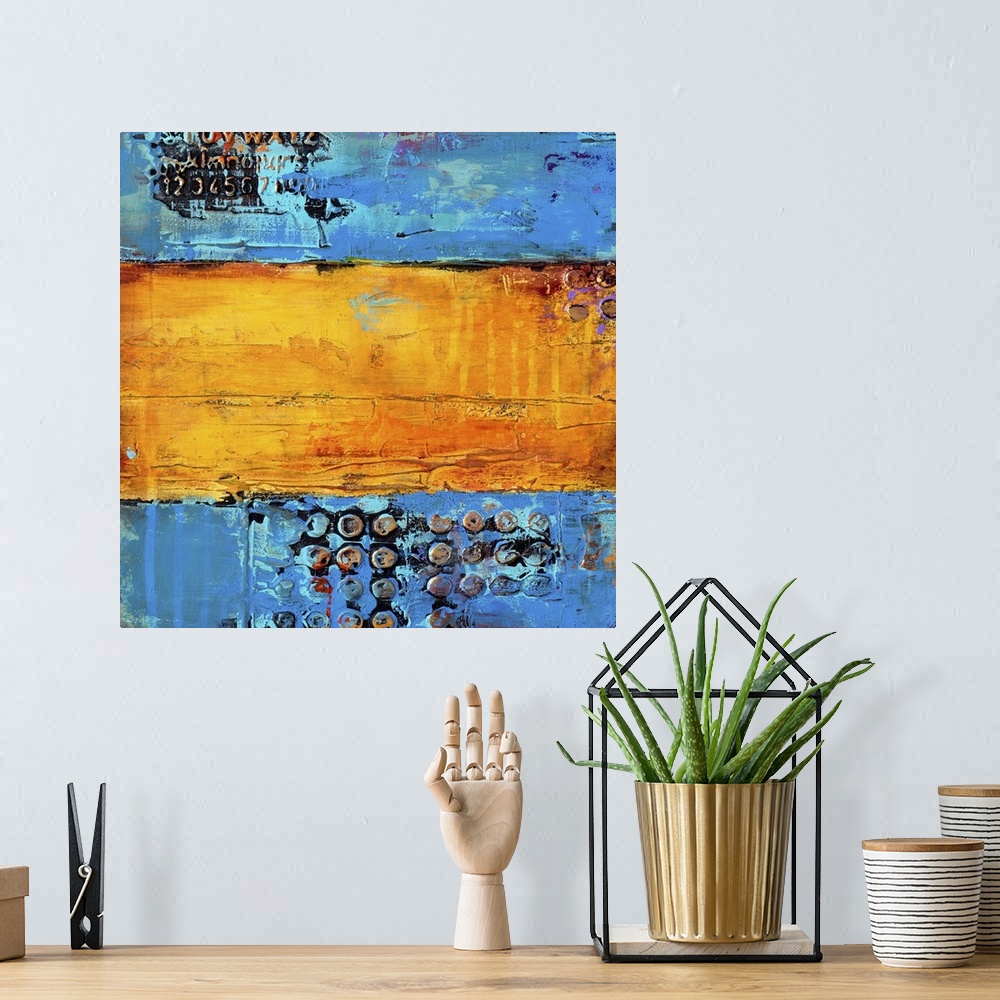 A bohemian room featuring A square contemporary abstract painting that has three vertical sections with a variety of blue a...