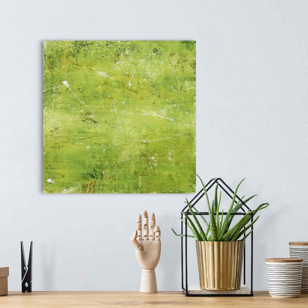 A bohemian room featuring Contemporary abstract painting using bright green and small splashes of white.