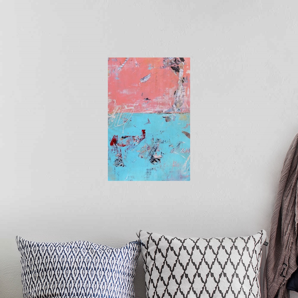 A bohemian room featuring A contemporary abstract made with a mixture of blue and salmon pink hues as well as newspaper cut...