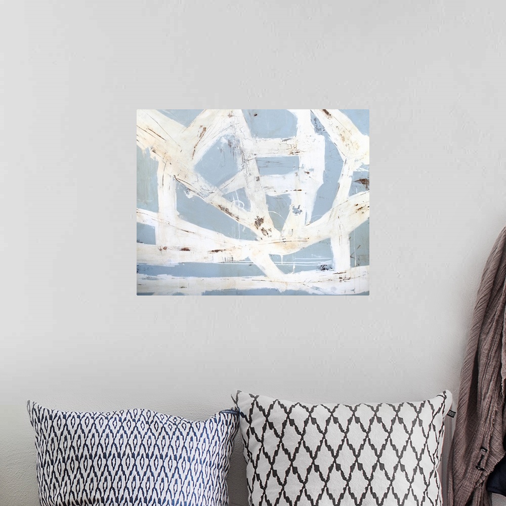A bohemian room featuring Contemporary abstract art print of swirling strokes of white over pale blue.