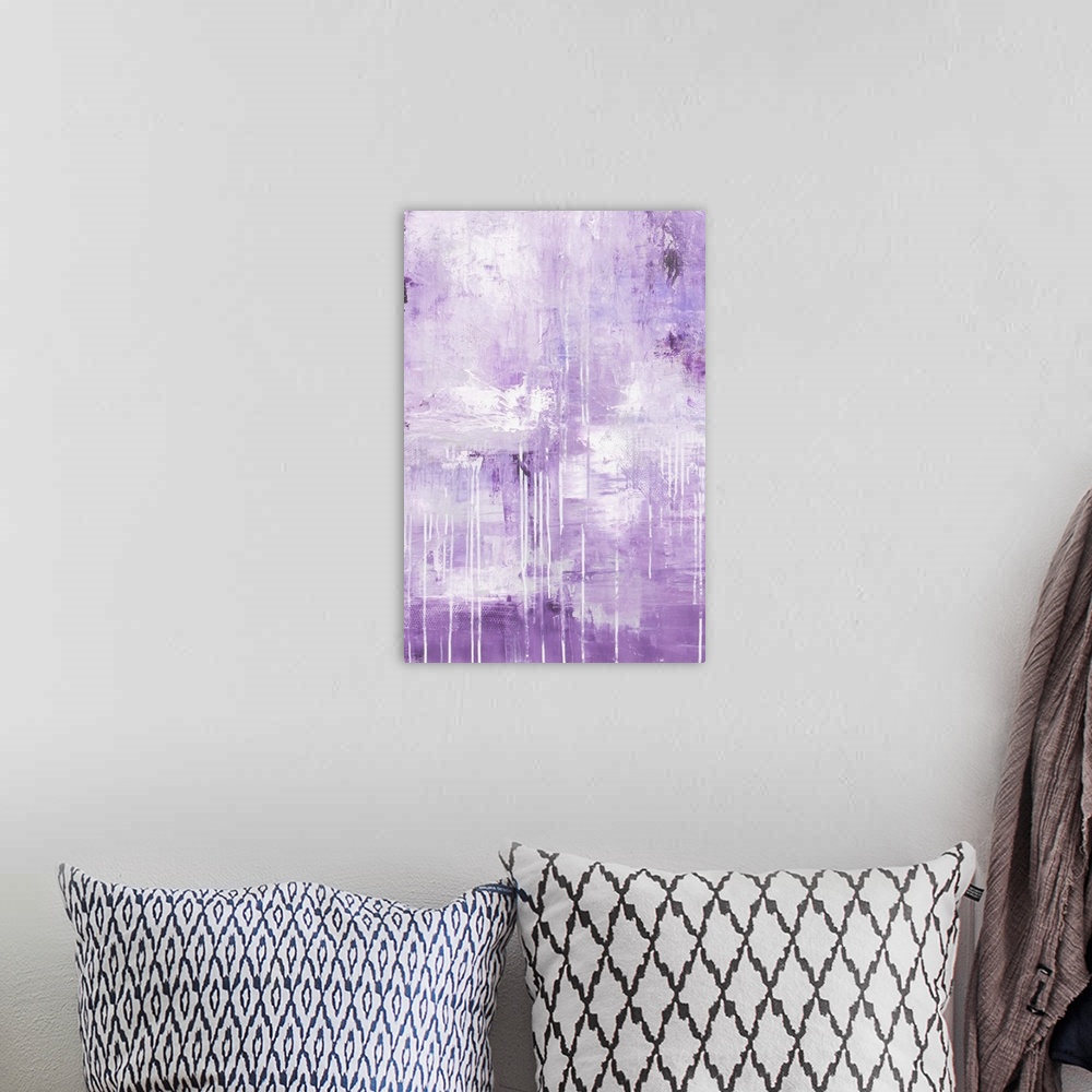A bohemian room featuring A contemporary abstract painting made up of mostly lavender mixed with darker shades of purple an...
