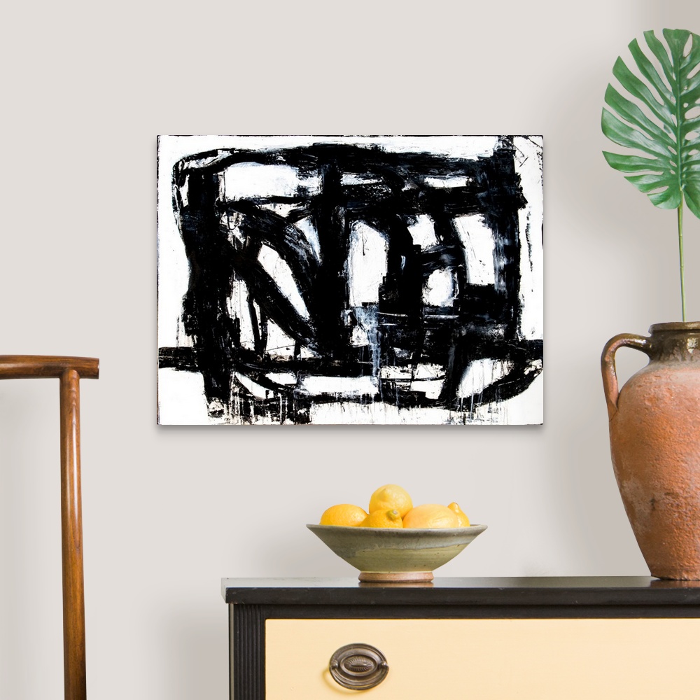 A traditional room featuring A black and white abstract painting of bold, black brush strokes going in different directions an...