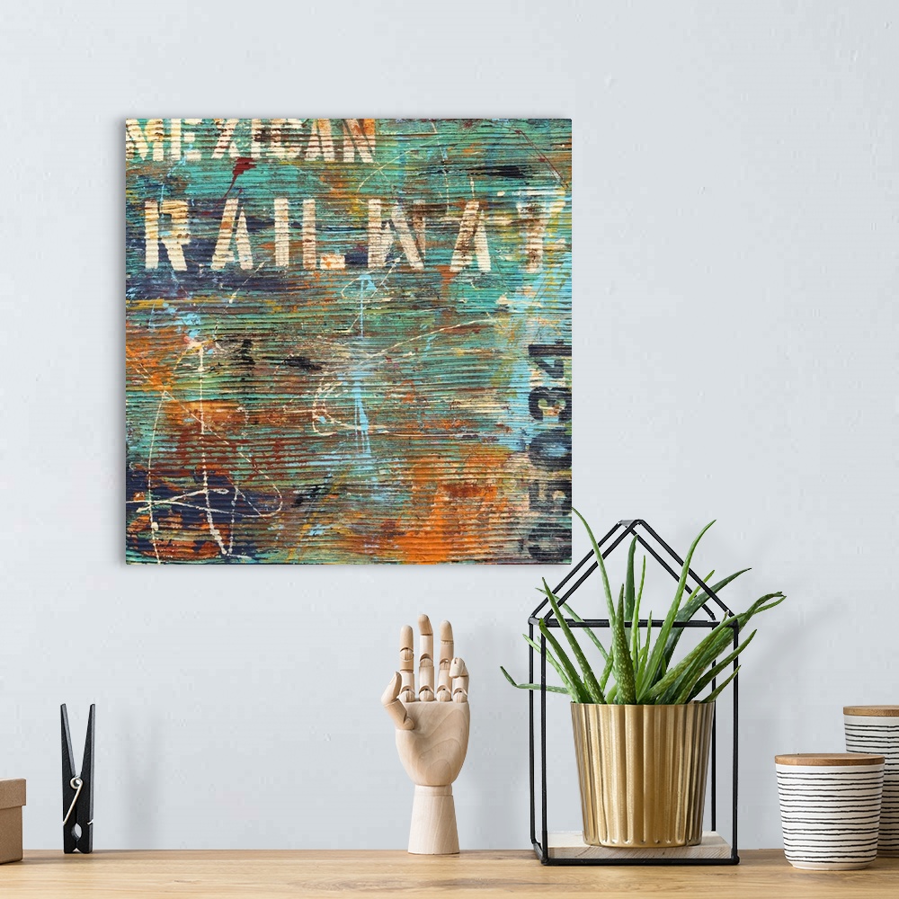 A bohemian room featuring Contemporary abstract artwork in teal and orange, with horizontal stripes and stenciled text.