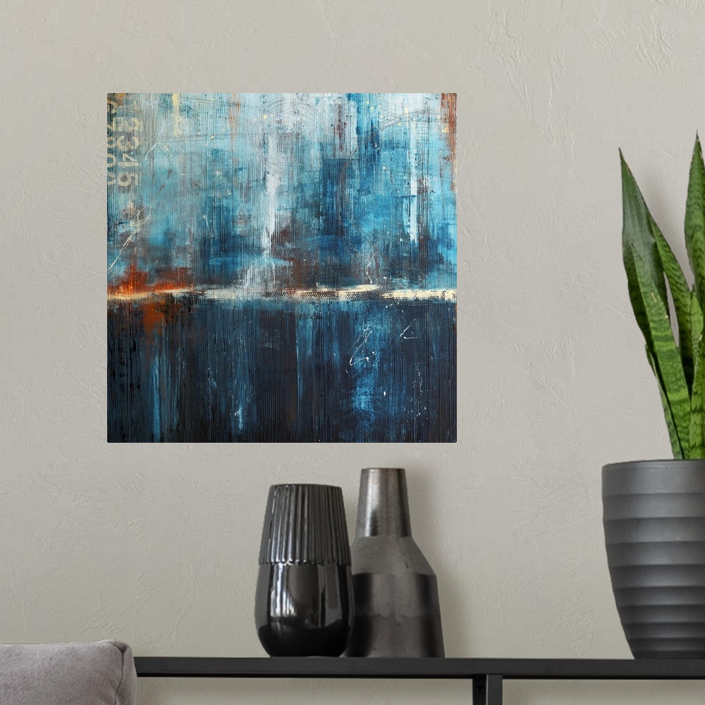 A modern room featuring Abstract canvas art of cool tones with heavy brush textures.