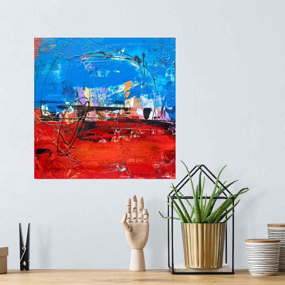 A bohemian room featuring Square abstract art with bright layers of paint and textures in shades of blue and red with pops ...