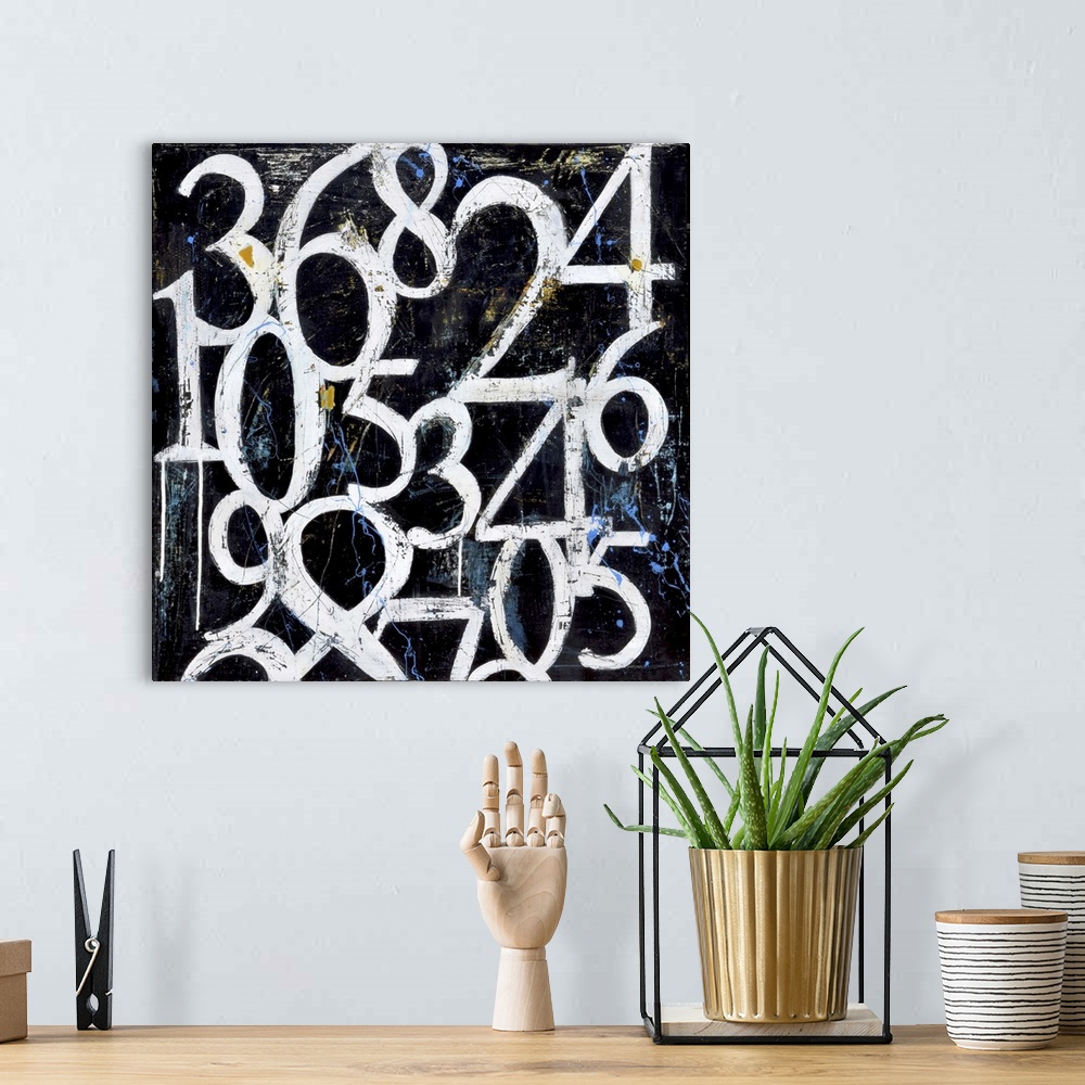 A bohemian room featuring Contemporary painting of white grungy looking numbers against a black and blue background.