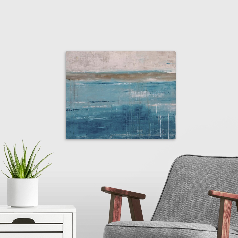 A modern room featuring A square contemporary abstract painting with a heavy blue tone throughout, accompanied by tan and...