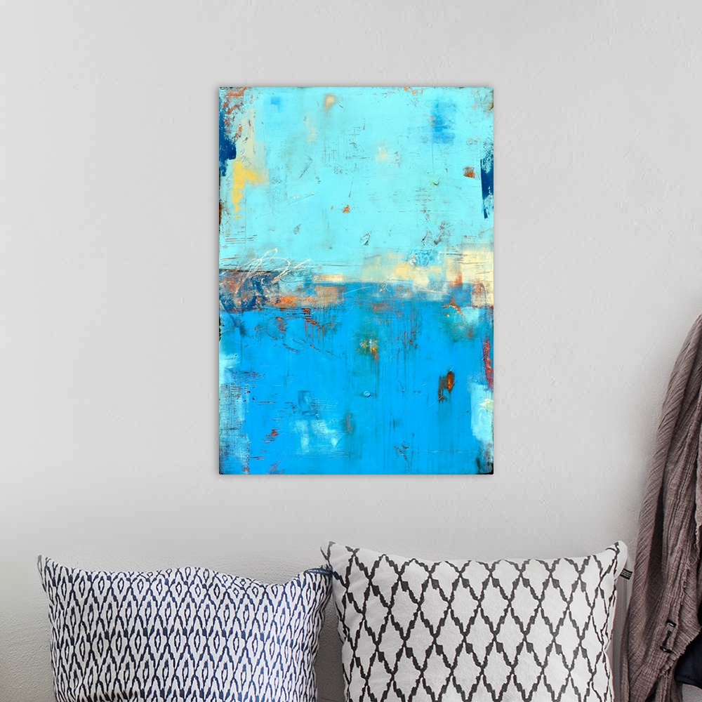 A bohemian room featuring Contemporary abstract painting using blue tones mixed with earthy tones.