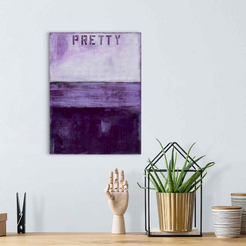 A bohemian room featuring Vertical abstract artwork created with different shades of purple and the word "Pretty" stenciled...