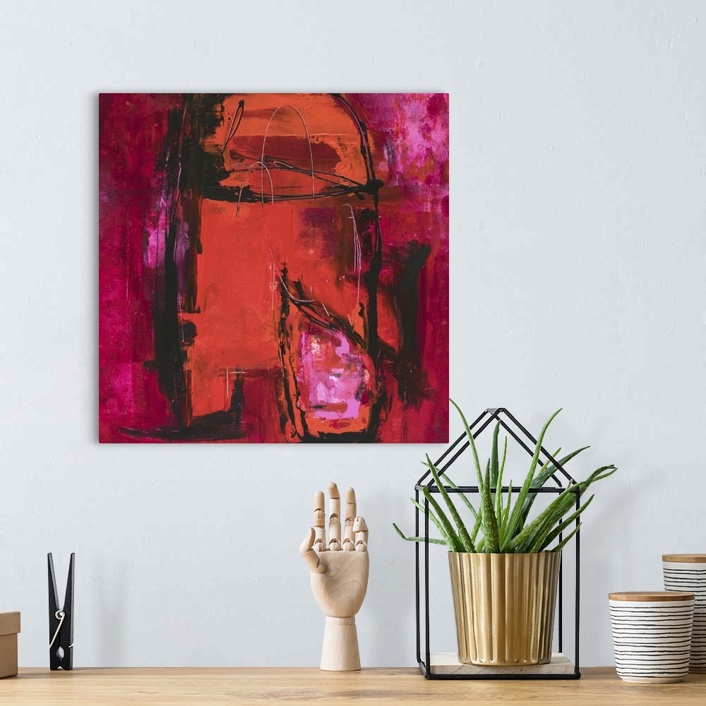 A bohemian room featuring Contemporary abstract artwork in shades of red and magenta.