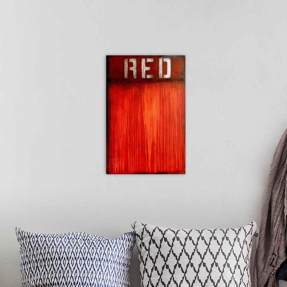 A bohemian room featuring Contemporary abstract art created in shades of red with paint drips and the word 'Red' stenciled ...