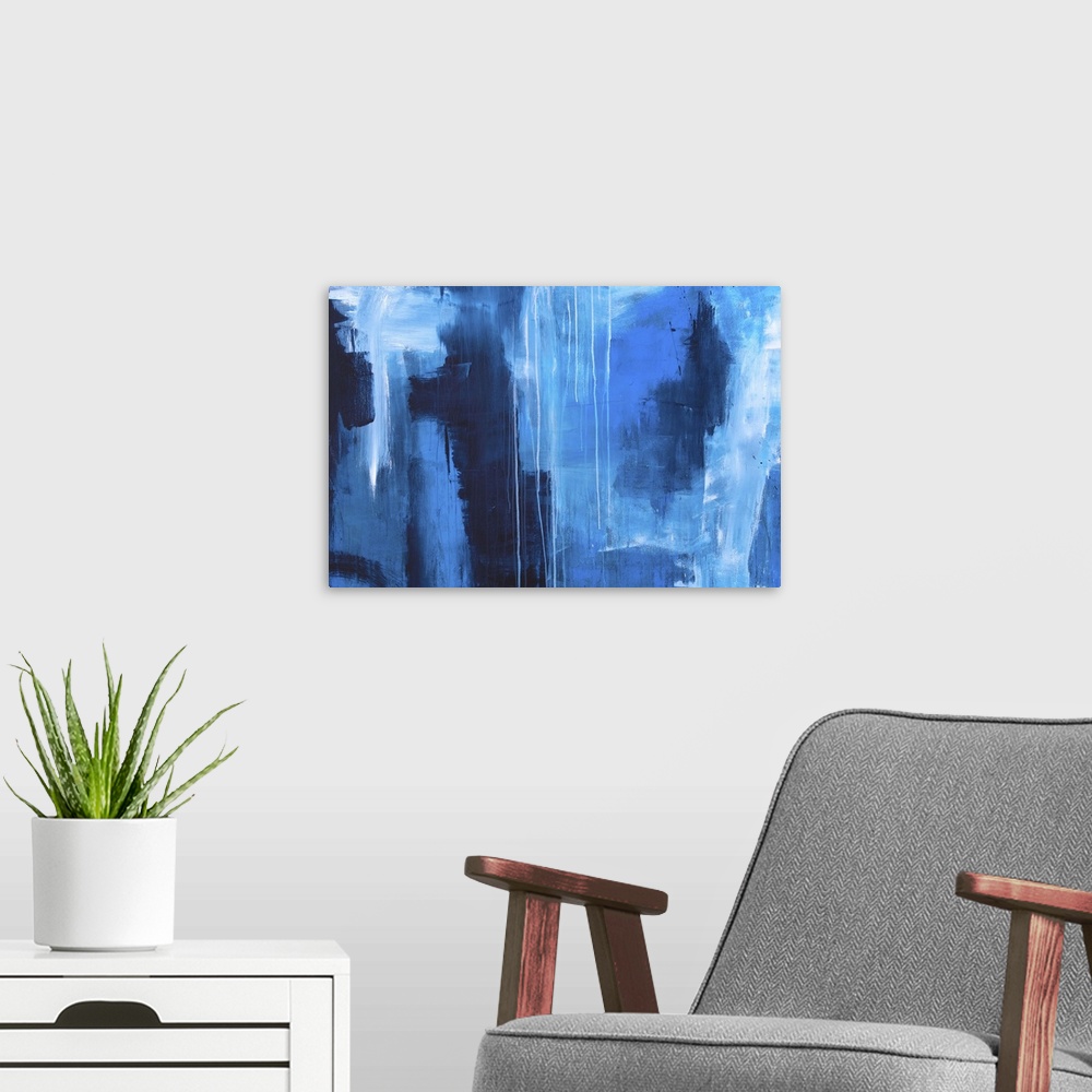 A modern room featuring Large abstract painting created with shades of blue and dripping white paint.