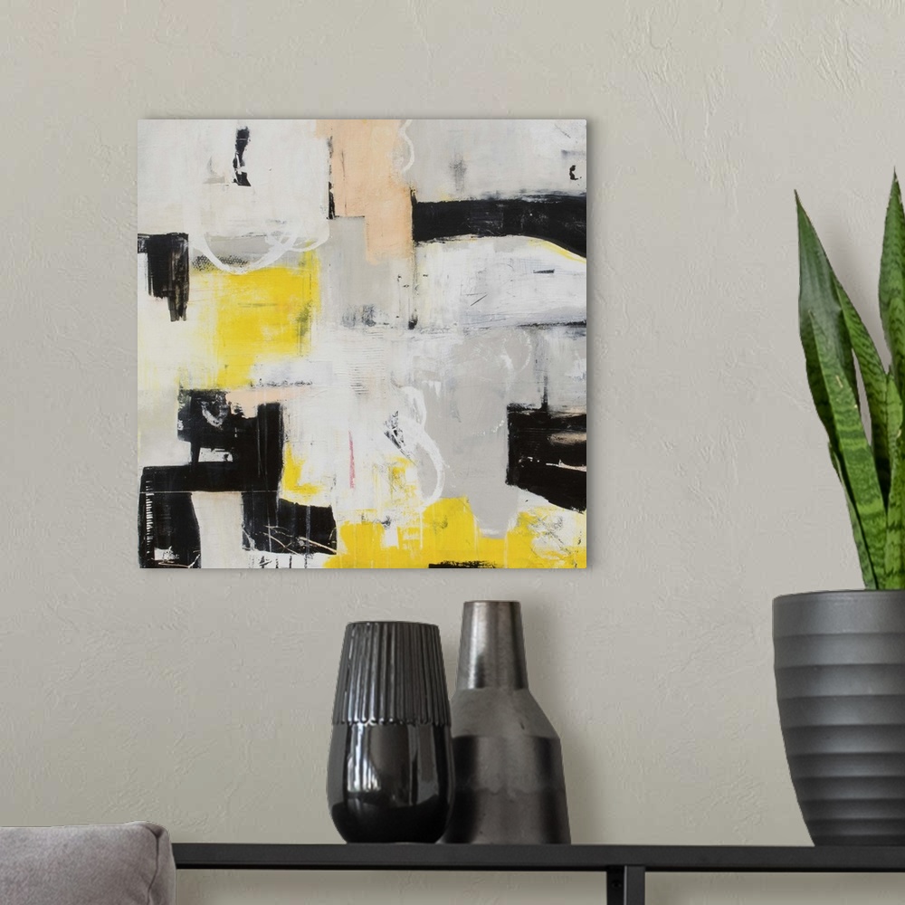 A modern room featuring Contemporary abstract art in grey and black with pops of yellow.
