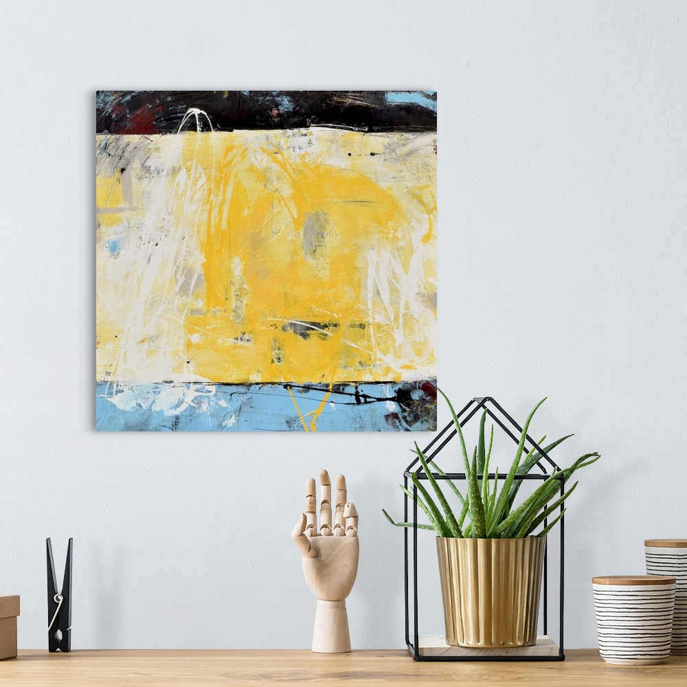 A bohemian room featuring Contemporary abstract color field style painting using blue, black and yellow.