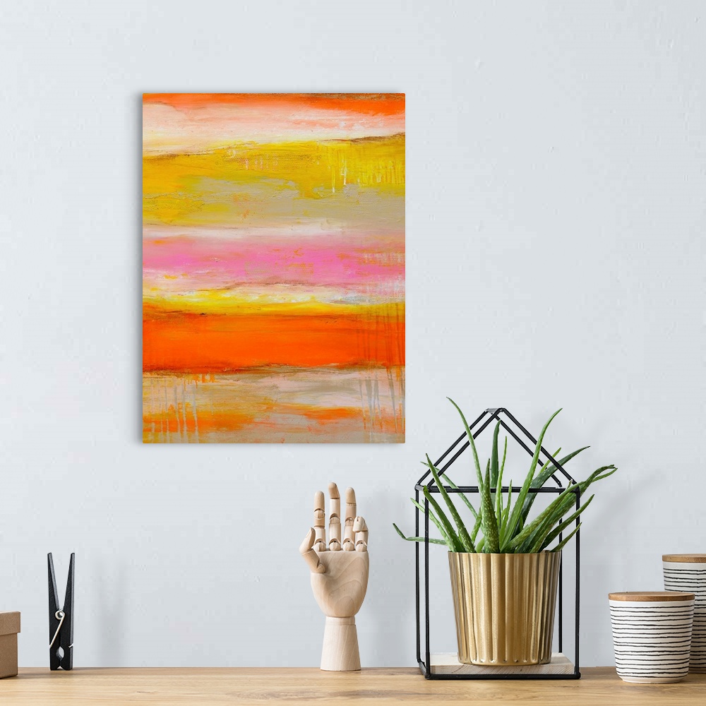 A bohemian room featuring Tall abstract painting of various bright colors layered horizontally with textured brush strokes.