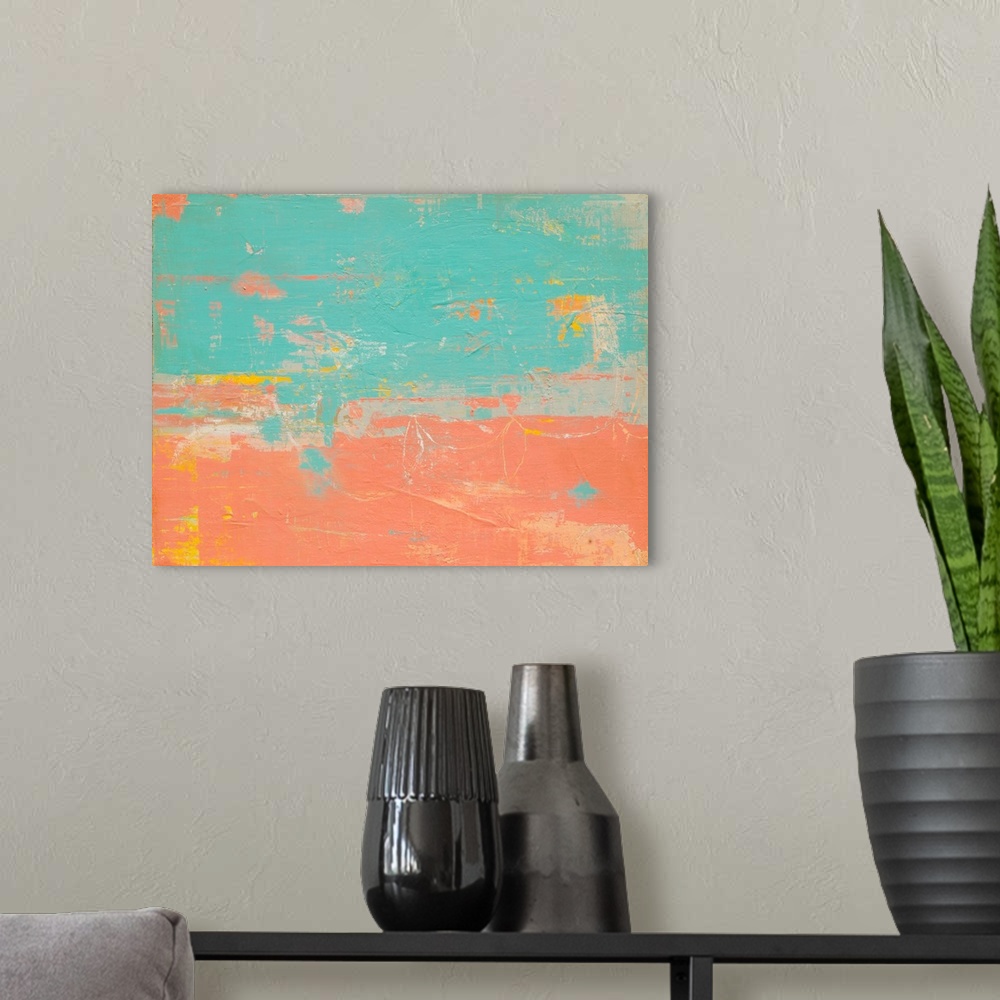 A modern room featuring Warm blue and salmon pink colored abstract painting with pops of yellow and orange.