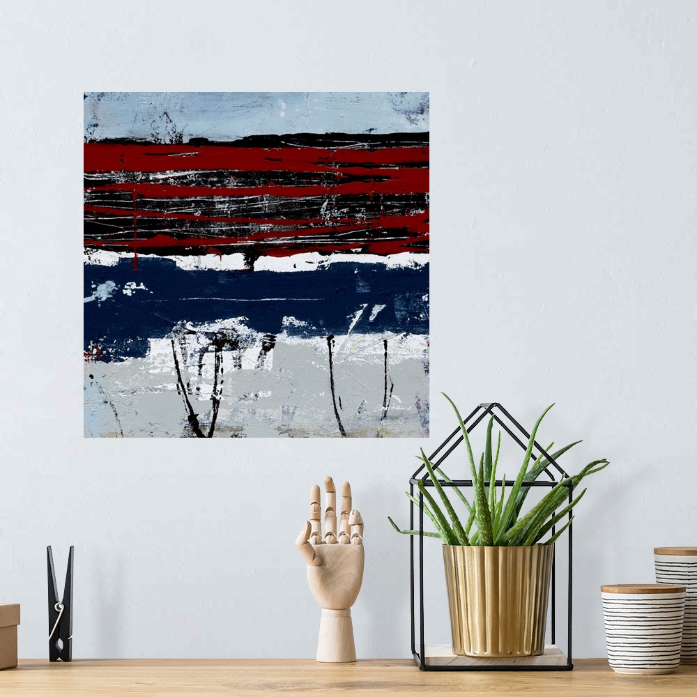 A bohemian room featuring Contemporary abstract art in red and navy blue with white stripes.