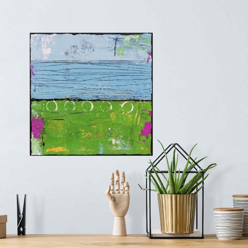A bohemian room featuring Contemporary abstract painting using bright green and blue tones.