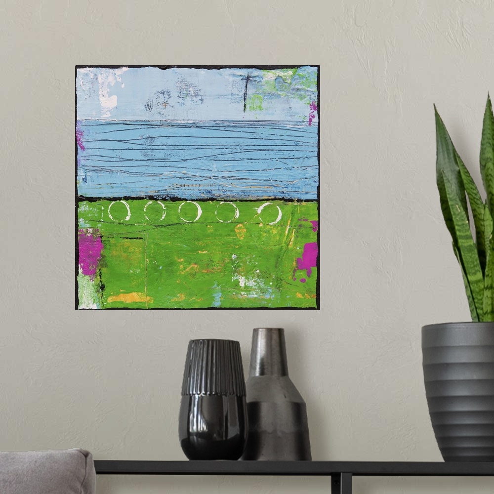 A modern room featuring Contemporary abstract painting using bright green and blue tones.