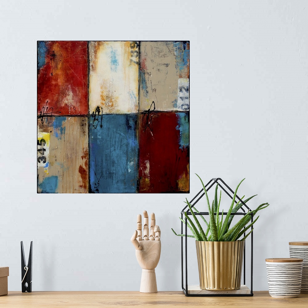 A bohemian room featuring Contemporary abstract artwork of blue, red, and white color blocks.