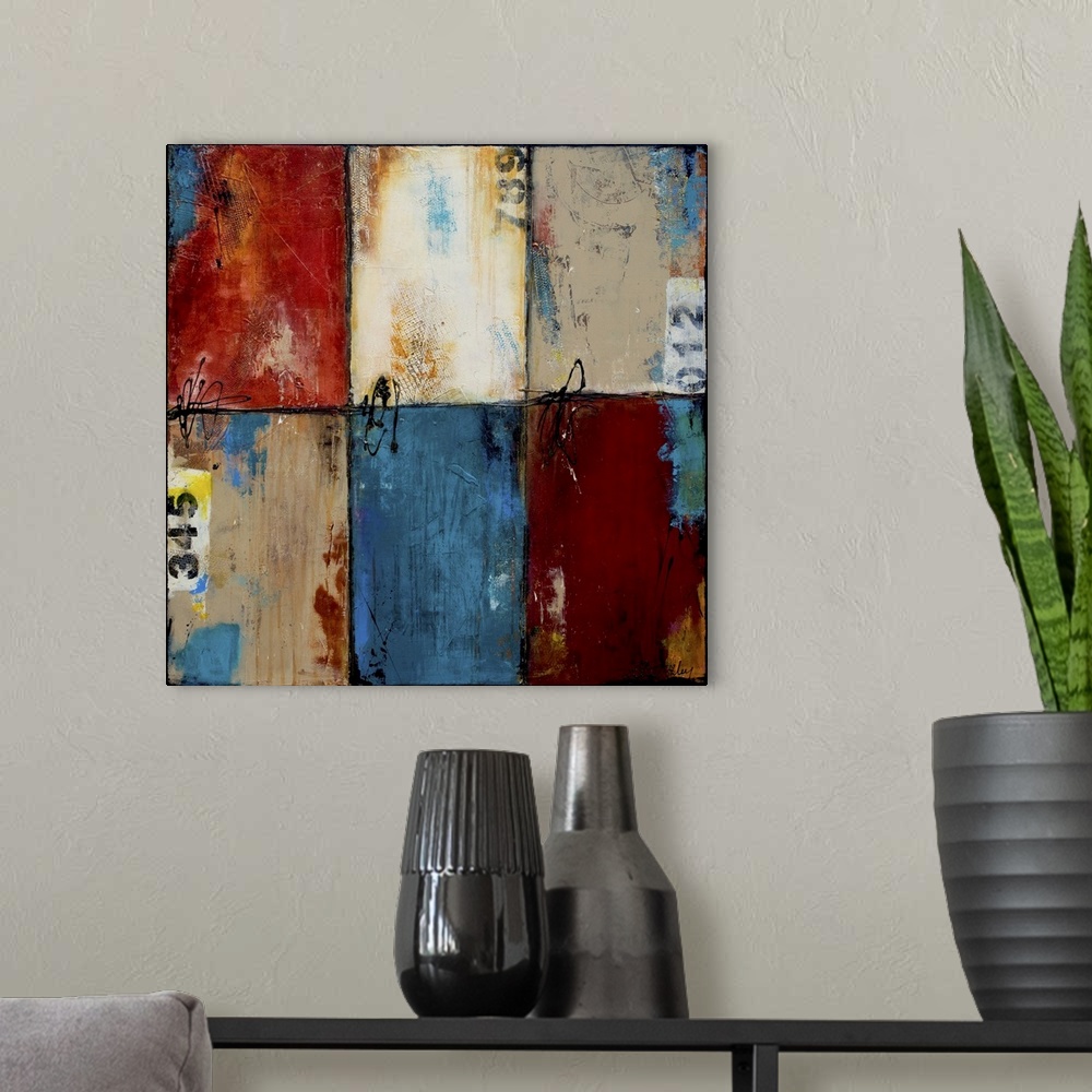 A modern room featuring Contemporary abstract artwork of blue, red, and white color blocks.