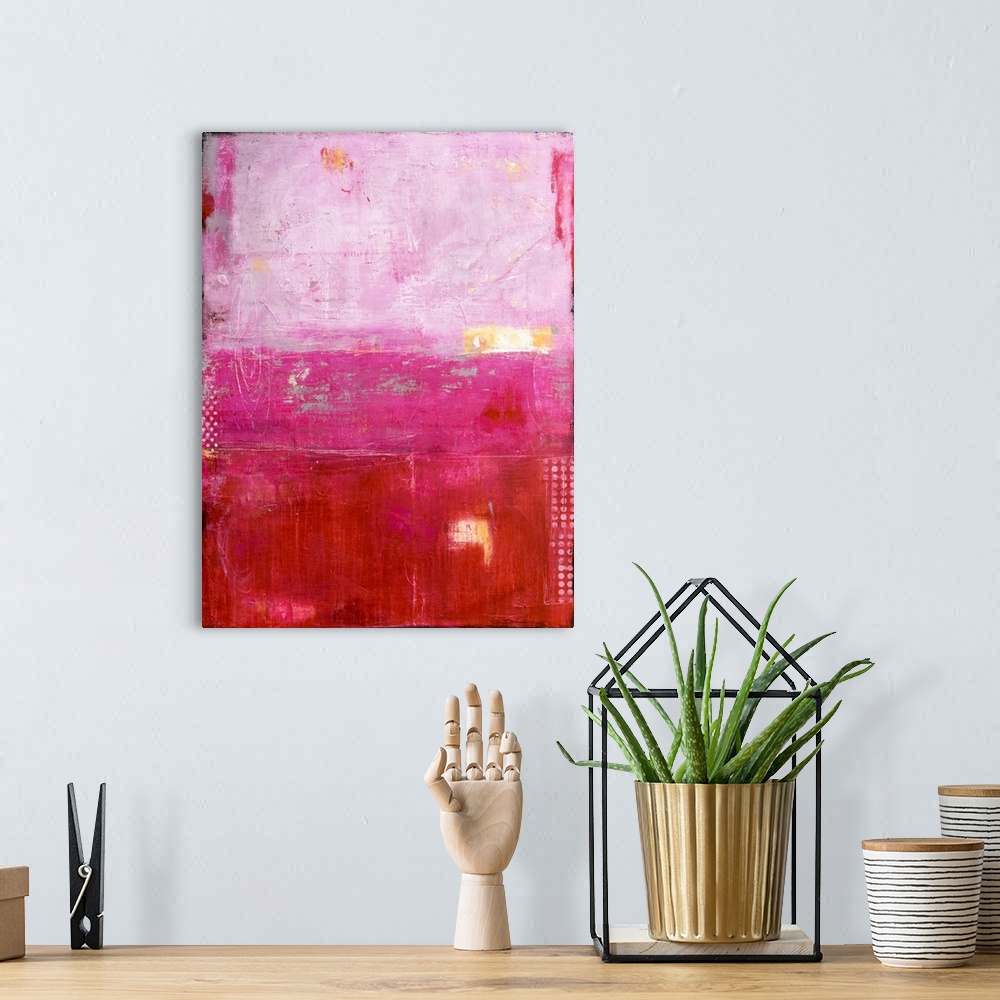 A bohemian room featuring A heavily textured abstract painting of three different painting styles and colors stacked on top...