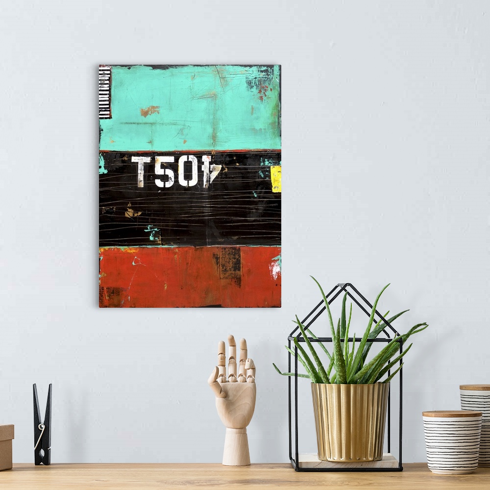 A bohemian room featuring A contemporary abstract painting separated into three horizontal sections of color: teal, black, ...