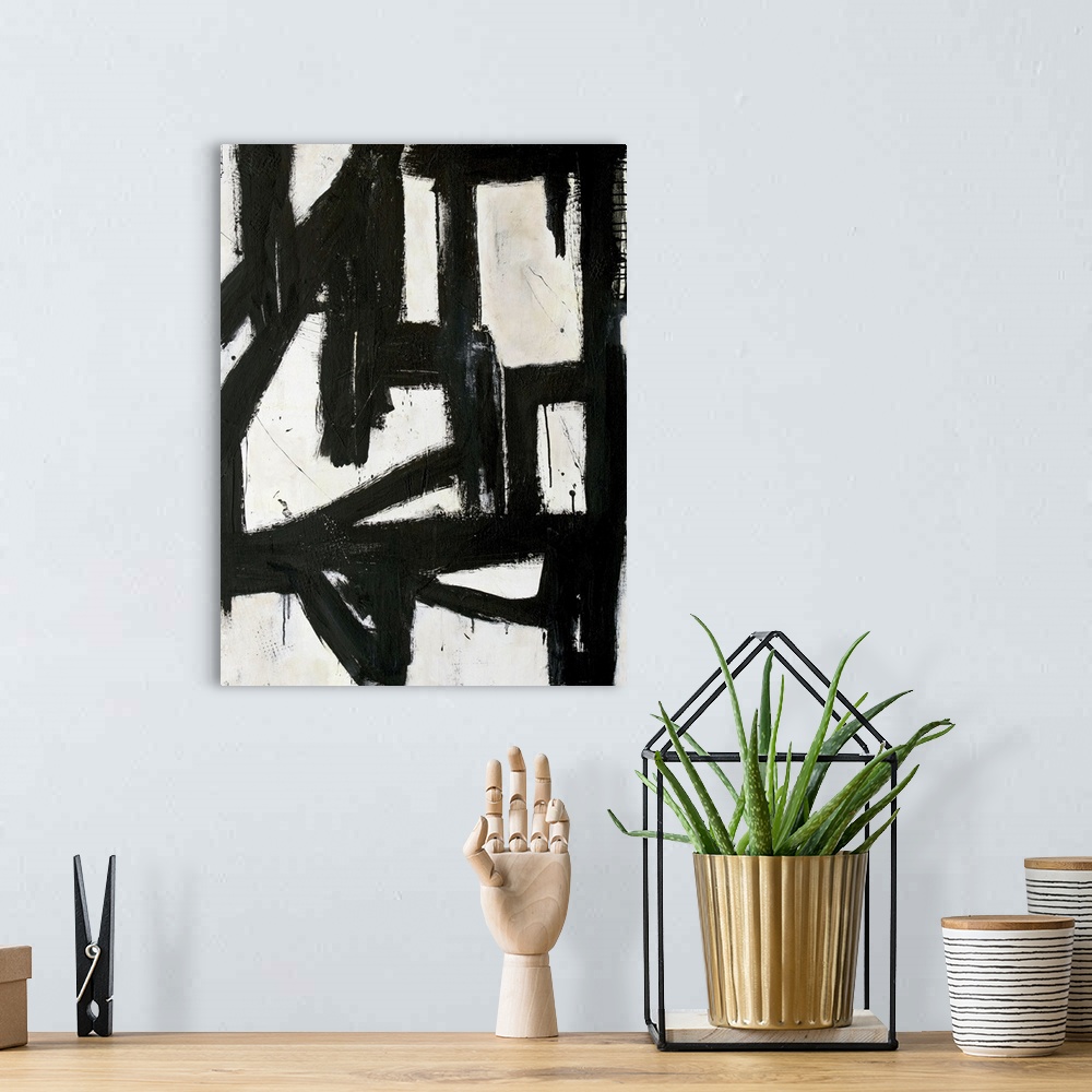 A bohemian room featuring Contemporary abstract painting with thick black lines on white.