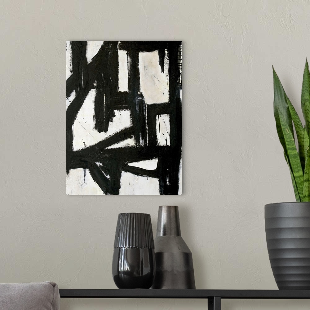 A modern room featuring Contemporary abstract painting with thick black lines on white.