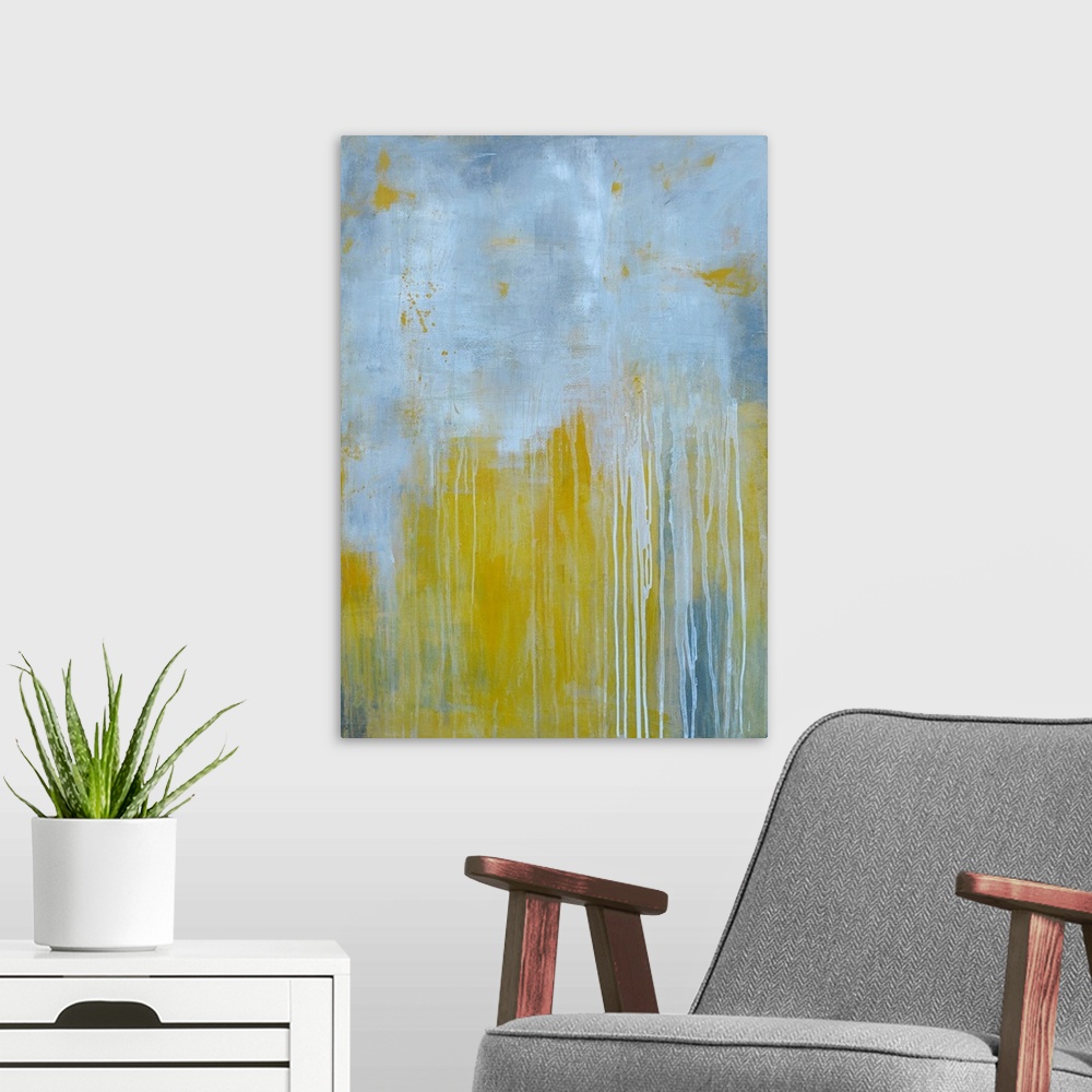 A modern room featuring Large abstract art comprised of two fairly equal patches of muted tones running into each other. ...