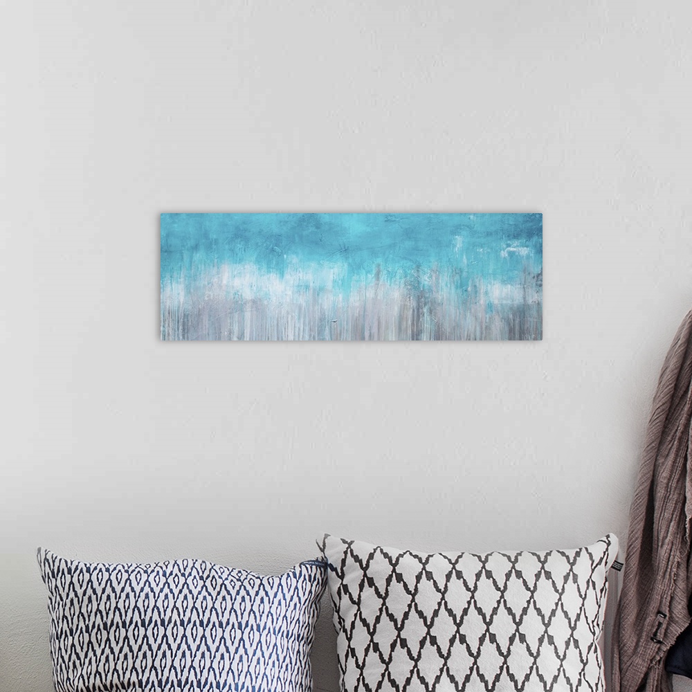 A bohemian room featuring Horizontal abstract painting created with turquoise turning into grey with streaking lines runnin...