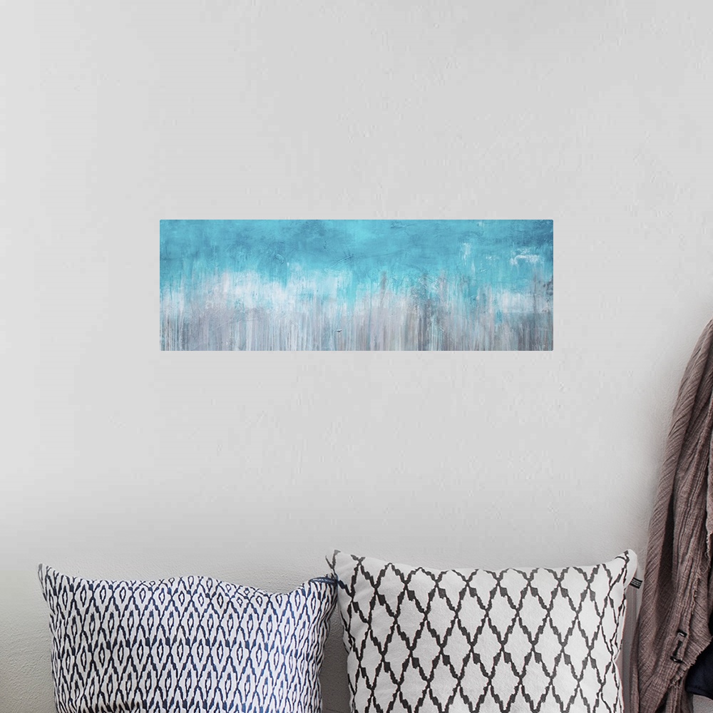 A bohemian room featuring Horizontal abstract painting created with turquoise turning into grey with streaking lines runnin...