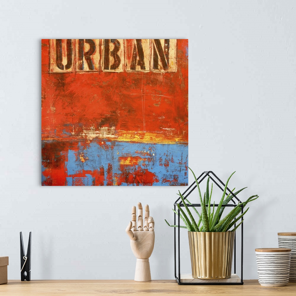 A bohemian room featuring Contemporary abstract painting of a weathered grungy dark orange and blue tones with the word "Ur...