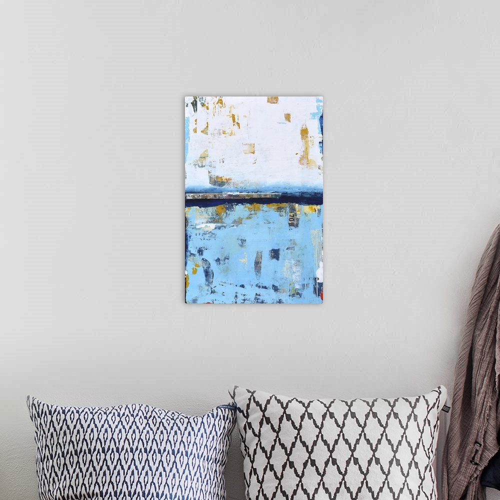 A bohemian room featuring A contemporary abstract painting using white and a pale blue meeting face to face.